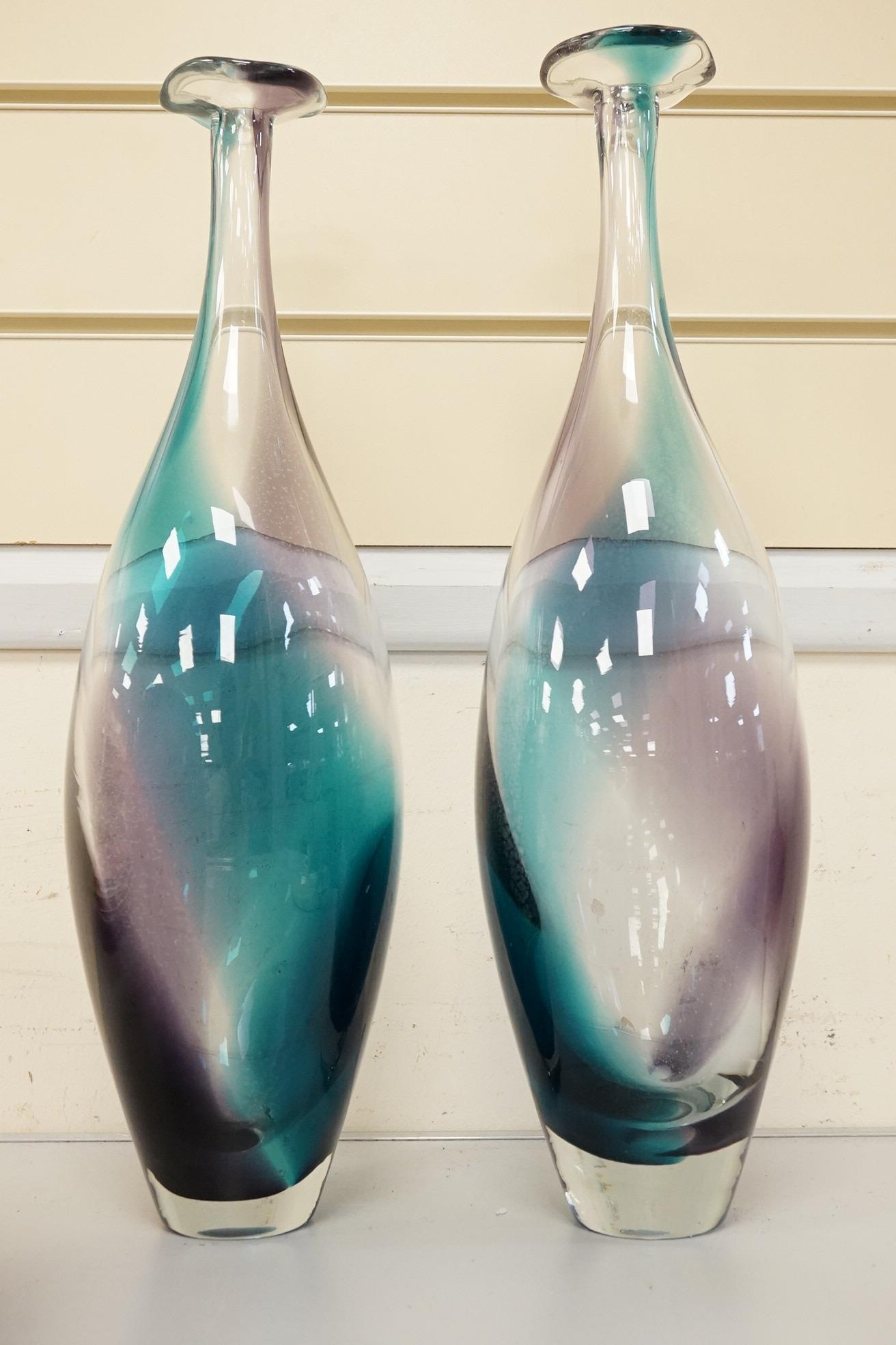 Three art glass vases to include a pair of purple and blue stem vases, 42cm high
